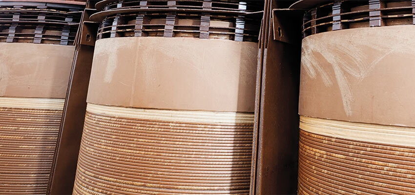 Estimation of water content in oil-impregnated cellulose materials in transformers
