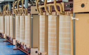 Improving energy and material efficiency in distribution transformers