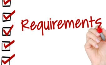 Hand filling in the checklist titled Requirements
