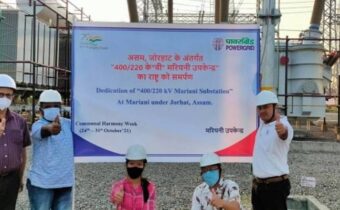 a group of people in front of a substation