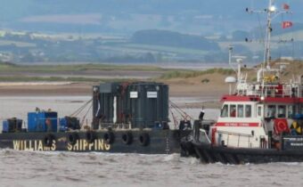 Tug boats accompany 178 T transformer as it passes Burnham-on-Sea