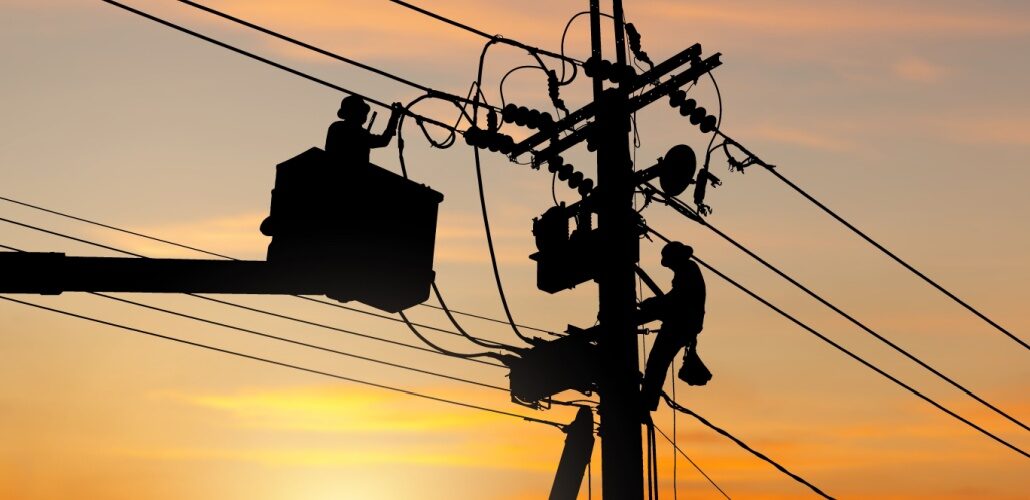 Kenya Power secures 3,319 local transformers electricians on a pole_shutterstock_2425315767
