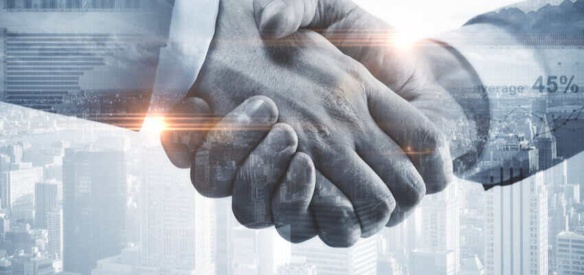 Hitachi ABB Power Grids commences operations shaking hands