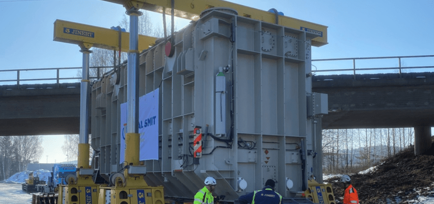 Hydra-Slide low profile system skids transformer under bridge and onto foundation substation utility products