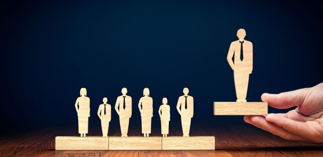 Manu Asthana to step down as PJM CEO wooden figures_Shutterstock_1252995856